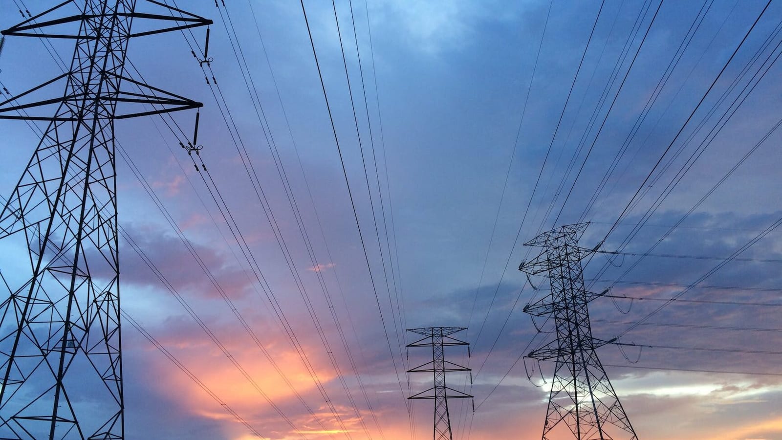 transmission tower under gray sky
